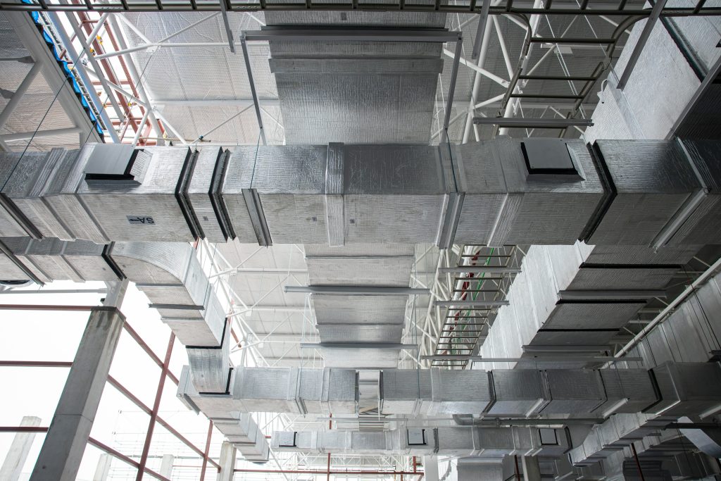 Industrial HVAC duct system in a large building. Medical Grade Ductwork ensures clean air. Ventilation system design in British Columbia.